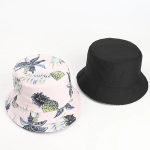 Tropical fruit print and solid black double-sided cotton bucket hats for sun protection