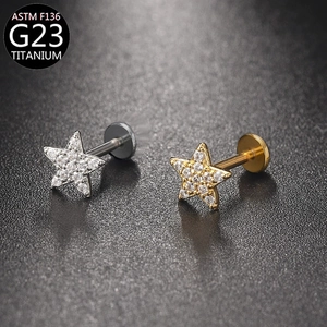G23 titanium labret stud with star design and zircons in gold and silver finishes
