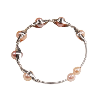 Handmade silver wire-wrapped bracelet with eight pink freshwater pearls on white background