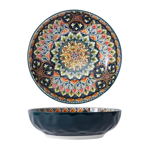 Bohemian ceramic bowl with colorful mandala patterns and dark green textured exterior