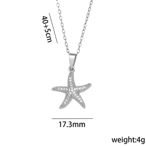 Silver starfish necklace with micro-paved zircons and pearls on a white background