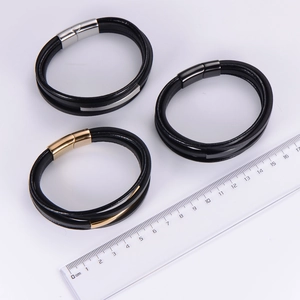 Detail view of multi-layer PU leather bracelets with magnetic clasps in three metallic colors