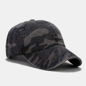 Detail of vintage camouflage baseball cap showing washed cotton texture and 6-panel design