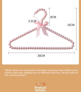 Pink pearl pet clothes hanger with silk bow detail and non-slip tip for small pets