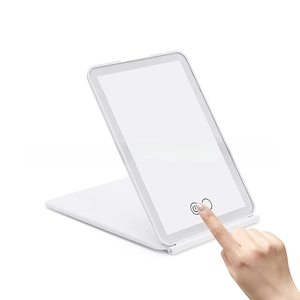 Detail of white foldable LED travel mirror with touch control and adjustable flip stand