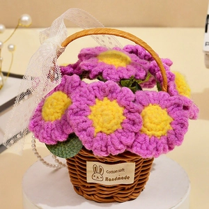 Detail of handmade crochet flower basket with pink petals, lace ribbons and pearl chain