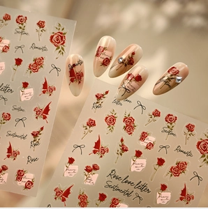 Detail of vintage French rose nail stickers with black ribbons and romantic text motifs