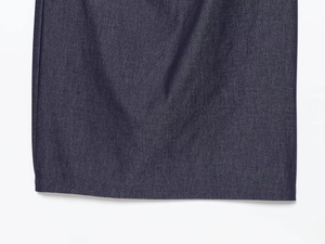 Detail view of deep blue twill fabric and neat stitching on a halter midi dress