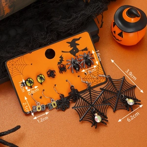 Halloween earring set with black spider, bat, and ghost BOO charms on orange background