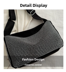 Detail of black sparkling rhinestone shoulder bag with adjustable wide strap and metal buckle