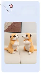 Close-up of soft plush meerkat toy on a leather sofa showing premium fluffy texture