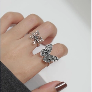 Retro hollow butterfly silver ring set featuring two stylish open metal knuckle rings
