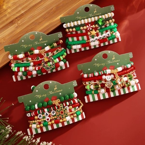 Detailed macro view of festive Christmas beaded bracelets with Santa and reindeer charms