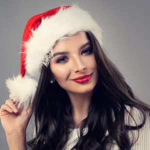 Close-up of a high-quality plush Christmas hat with soft red fabric and white fur trim