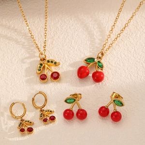 Golden cherry jewelry set with red zircon and resin necklaces and earrings