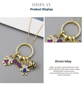 Detail of gold-plated box chain with detachable cubic zirconia charms for kids