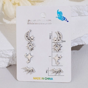 Four-piece stainless steel stud earring set with moon, sun, and star designs on card
