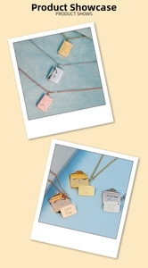 Detail of envelope locket necklace showing opening pendant and Love You metal insert