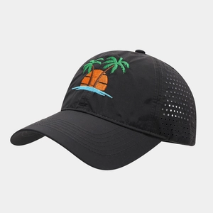Detail of embroidered palm trees and sunset on a breathable black baseball cap