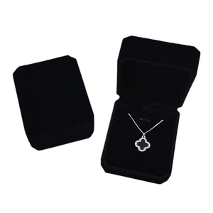 Elegant octagonal velvet jewelry boxes with silver clover pendant necklace display