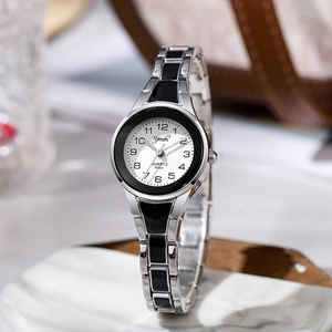 Close-up of Ymbr silver steel quartz watch with a white dial and black numerals