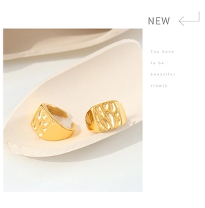 Detail of gold minimalist open ring featuring a unique rectangular hammered texture surface