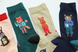 Detailed knit patterns of whimsical woodland animal illustrations on soft cotton socks