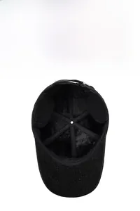 Detailed view of winter baseball cap showing thick black fleece lining and ear protection