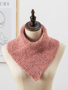 Close-up of pink knit snood scarf featuring thick speckled wool yarn on a mannequin