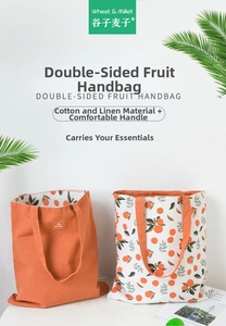Close-up of double-sided cotton linen tote bag featuring orange print and wide handle