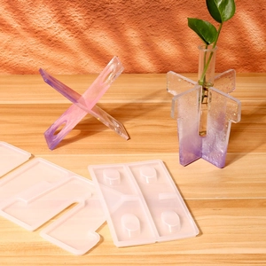 Macro detail of translucent silicone mold and DIY purple gradient resin test tube vase base