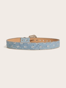 Close-up of distressed light blue denim belt with silver sequins and bead chain edges