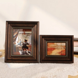 Retro dark brown wooden photo frame set with golden studs and classical oil paintings
