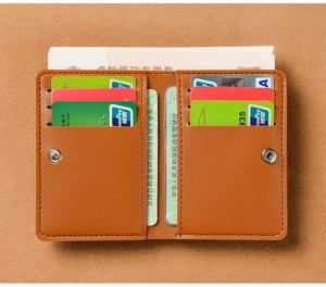 Detailed view of brown leather card wallet with multi-slot layout and snap closure