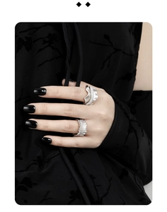 Close-up of S925 sterling silver rings with wavy texture and micro-paved diamonds for women