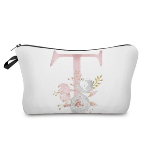 Detailed view of white canvas makeup bag featuring pink floral letter T printed pattern