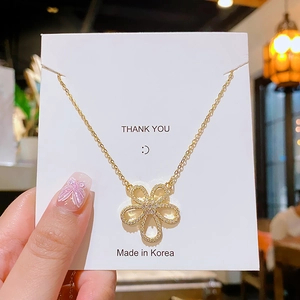 Elegant gold flower necklace with sparkling zircon petals and delicate titanium steel chain