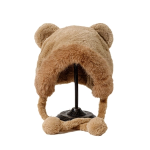 Brown plush winter bucket hat with bear ears, faux fur trim and cute pom-poms