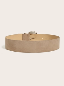 Macro detail of khaki suede wide belt showing fine texture and metallic buckle finish