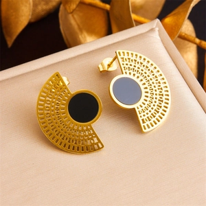 Gold-plated stainless steel hollow fan earrings with black round center on jewelry box