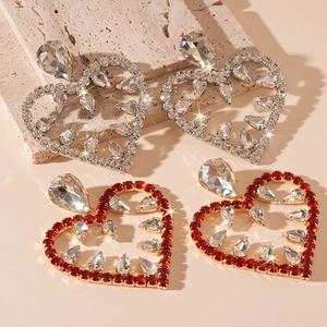 Exaggerated silver needle heart drop earrings with luxury rhinestone inlay in gold and red