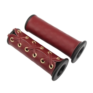 Detail of dark red leather motorcycle handle grips with vintage stitching and lace-up design