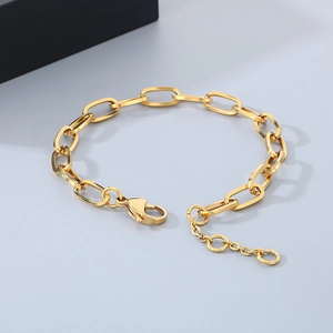 Detail of golden rectangle link chain necklace with lobster clasp and extension chain