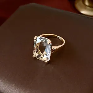 Luxury 14k gold plated open ring with a large rectangular crystal in a prong setting