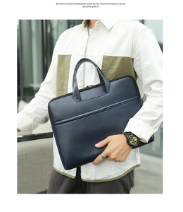 Detail of navy blue PU leather laptop bag with high-quality stitching and handle