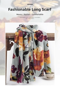 Detail of butterfly and floral print scarf with soft fringe edges on a wooden rack