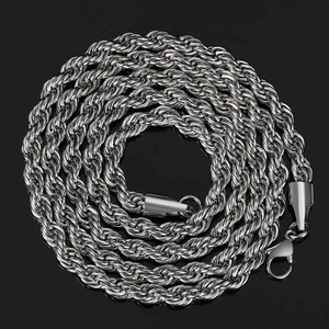 Detail shot of a polished silver rope chain necklace with a sturdy lobster clasp on black background