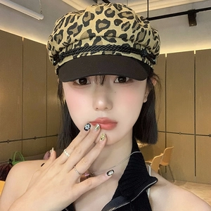 Stylish Y2K leopard print baker boy hat with black brim and decorative braided cord