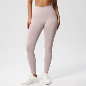 Close-up of lilac seamless yoga pants featuring a wide high-waist band and peach lift design