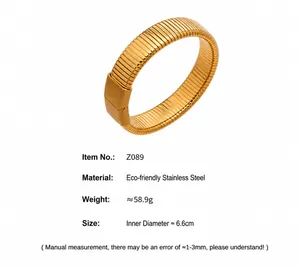 Detail of gold flexible Tubogas bangle with eco-friendly stainless steel specs and size info
